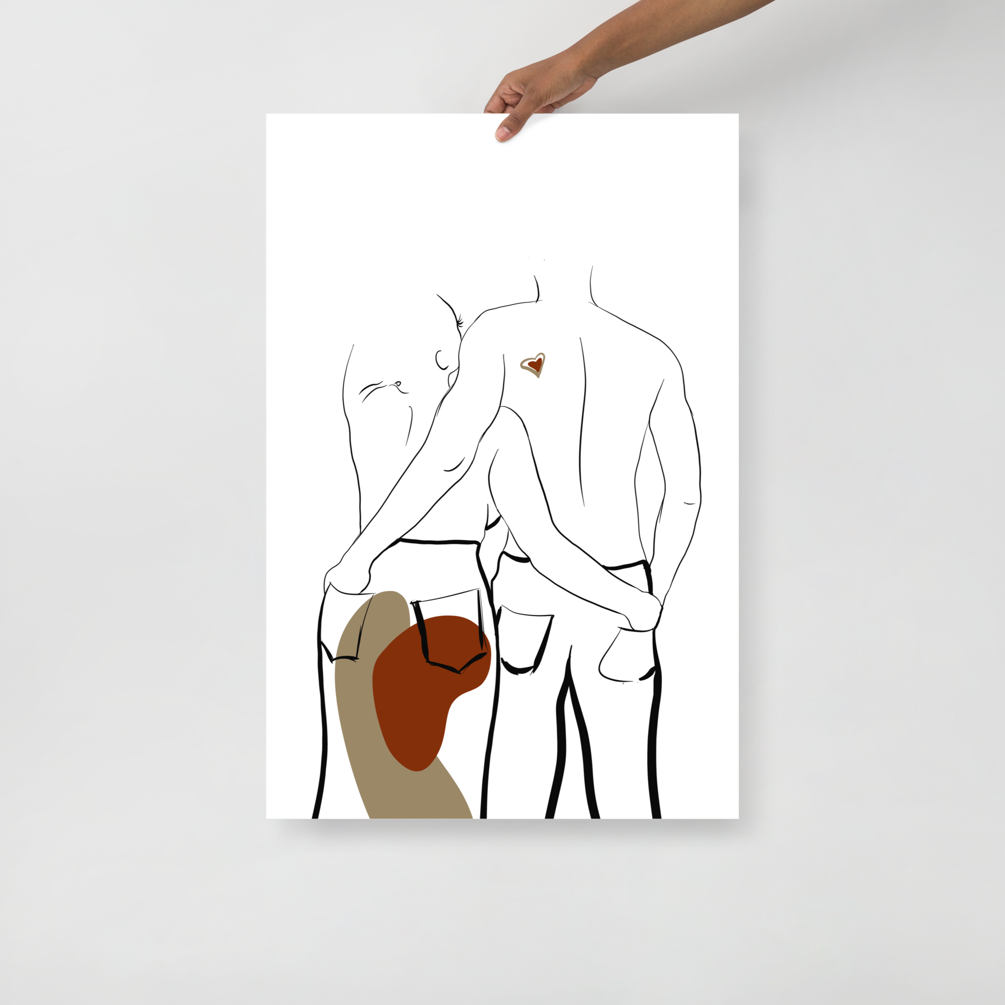 wall art of couple with hands in each others back pockets